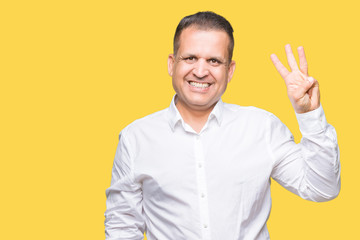 Middle age arab elegant man over isolated background showing and pointing up with fingers number three while smiling confident and happy.