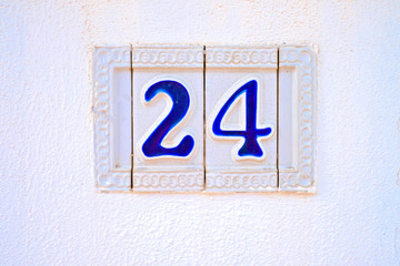 24, number twenty-four, blue decorative numerals on white surface.