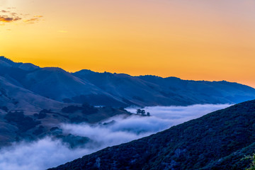 Panorama at Sunset with Cloud-filled Valley