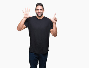 Fototapeta premium Young handsome man over isolated background showing and pointing up with fingers number seven while smiling confident and happy.