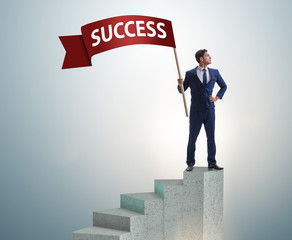 Businessman with success banner in business concept