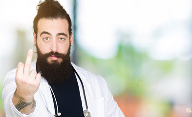 Doctor with long hair wearing medical coat and stethoscope Showing middle finger, impolite and rude...