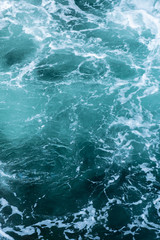 Fototapeta na wymiar Swirling blue Waters in Pacific Ocean Vertical