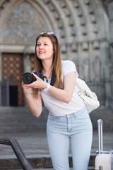 Female is taking photos on her camera