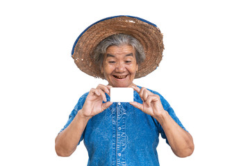 Happy old farmer woman holding a smart card on a white background.