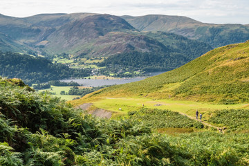 Fototapeta na wymiar Hikking between Brotherswater and Angle Tarn near Patterdale in the English Lake Districr surrounded by many Wainwrights