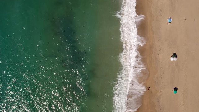 Amazing aerial shot of golden beach and green sea. Piscinas, Costa Verde, Sardinia