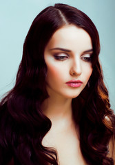 young pretty brunette woman with hairstyle waves, luxury look fashion makeup close up