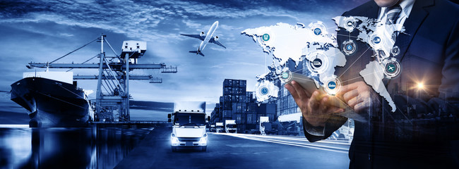 Multiple exposures of Businessman touching tablet for analyze stock at logistics port and world map...