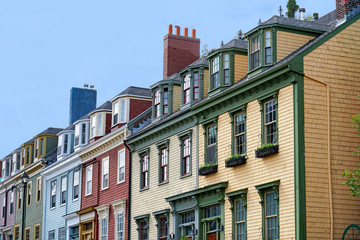 Row of colorful Victorian clapboard houses