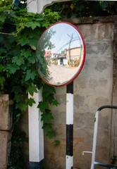 Reflection in concave lens mirror. Street or Traffic Concave Mirror. Image formed by concave mirror is generally real and inverted.