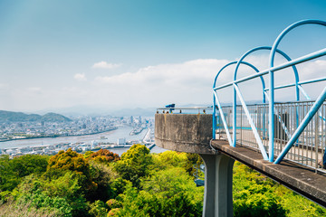 Kochi cityscape panorama from Godaisan mountain Observatory in Kochi, Shikoku, Japan - obrazy, fototapety, plakaty