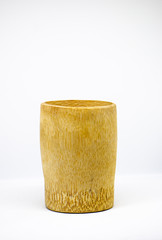 Natural bamboo cup. A small cup made from real and pure bamboo. Handcrafted or handmade household item.