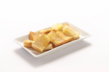 Thai Baked Toast with milk and sugar on white plate.