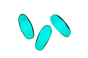 Bad shape expired blue pills on background