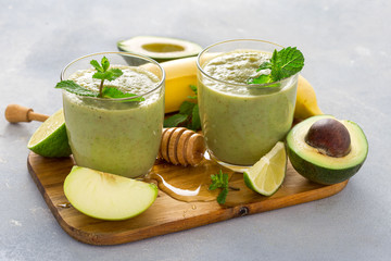 Healthy clean eating concept Glass mug with green health smoothie on a table