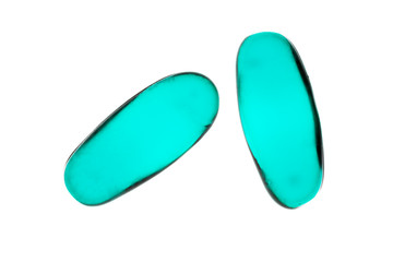 Bad shape expired blue pills on background