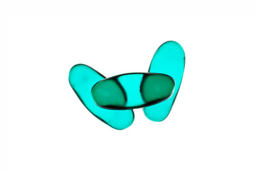 Bad shape expired blue pills on background