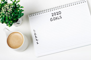 Inscription Goals 2020 in a notebook, close-up, concept of planning, setting purpose