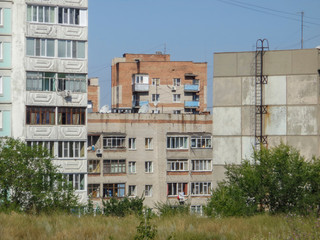 Apartment buildings. Ust-Kamenogorsk (Kazakhstan). Cityscape. Urban architectural background. Old and New. Abstract landscape. Residential area