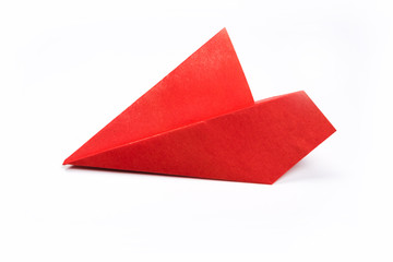 Red paper airplane isolated on white background. top view.