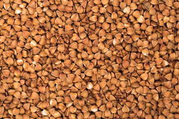 Macro Photo food buckwheat groats. Texture background grain buckwheat groats. Image food product porridge buckwheat grains