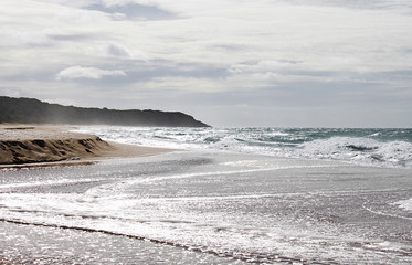 Waves flooding the shore.