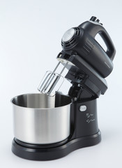 A mixer, hand mixer or stand mixer, is a kitchen device that uses a gear-driven mechanism to rotate a set of "beaters" in a bowl containing the food or liquids to be prepared by mixing them.