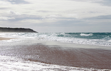 Fototapeta premium Ebb and flow of the sea at Lake Tyers beach. Australia.