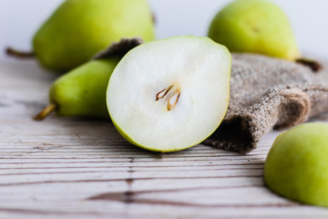 Green pears on wooden background. Background