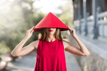 Fashion portrait of a beautiful woman in red hat