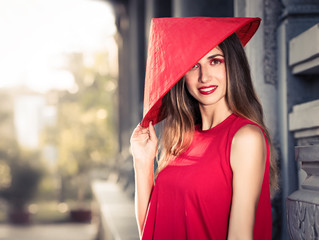 Fashion portrait of a beautiful woman in red hat