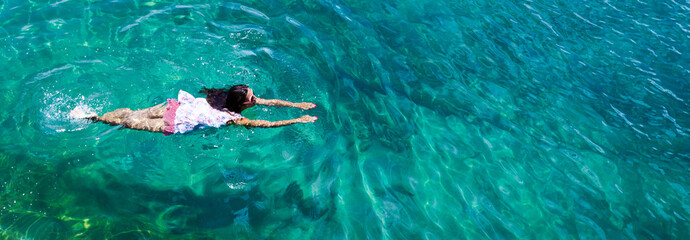 Aerial view of a woman in the sea