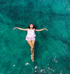 Aerial view of a woman in the sea