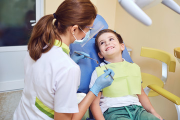 A child with a dentist in a dental office.