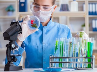 Female scientist researcher conducting an experiment in a labora