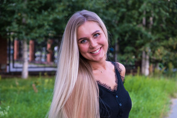 Naklejka premium Portrait of a natural beauty girl with long blonde hair. Hair care concept.