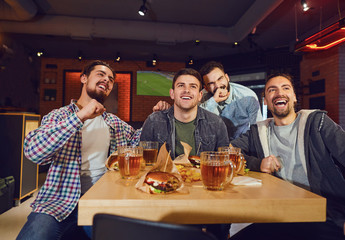 Friends fans watch sport tv in the pub