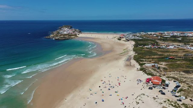 Aerial view of island Baleal naer Peniche on the shore of the ocean in west coast of Portugal. Baleal Portugal with incredible beach and surfers. Aerial footage of Baleal, Portugal. 4k quality