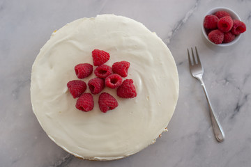 Cheesecake slice with raspberries on a plate