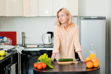 Young woman cooking in the kitchen