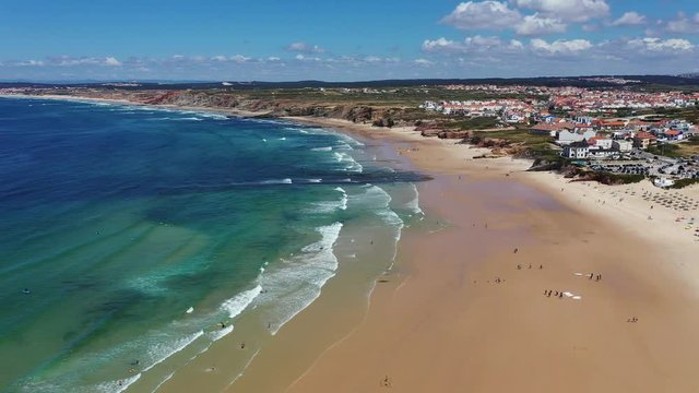 Aerial view of island Baleal naer Peniche on the shore of the ocean in west coast of Portugal. Baleal Portugal with incredible beach and surfers. Aerial footage of Baleal, Portugal. 4k quality