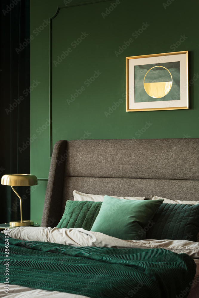 Wall mural Green cushions and blanket on the bed in glamour bedroom