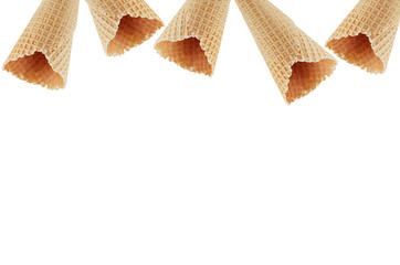Empty waffle ice cream cones as decorative frame isolated on white background.