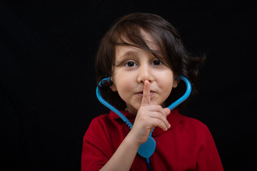 Little friendly doctor holding stethoscope ready to examine