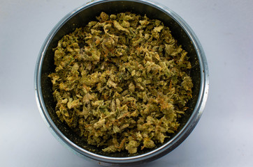 Ground Cannabis in grinder