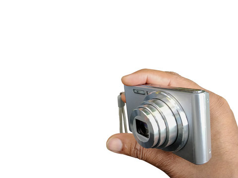 digital camera in hand isolated on white background