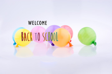 Colorful small balloons on a white background