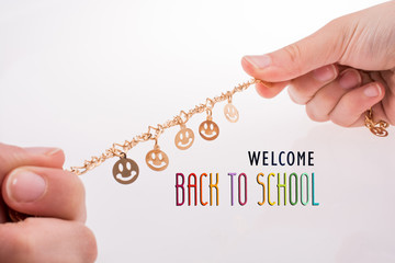 smileys on a chain in hand