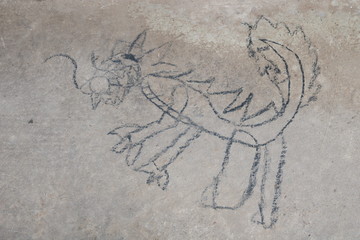 kid drawing with charcoal